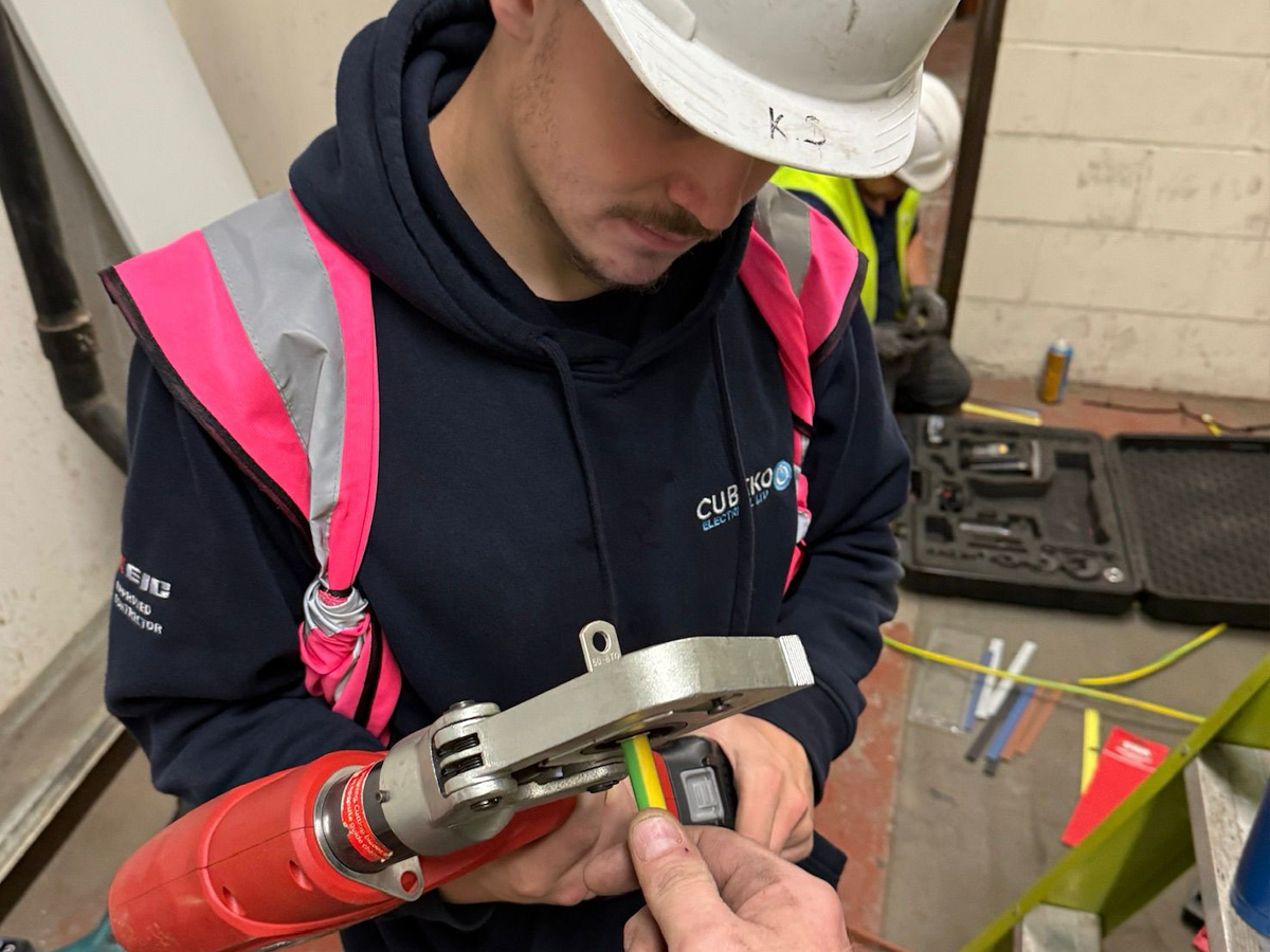 Cubeko Electrical engineers carrying out two-person cable crimping during an industrial electrical installation